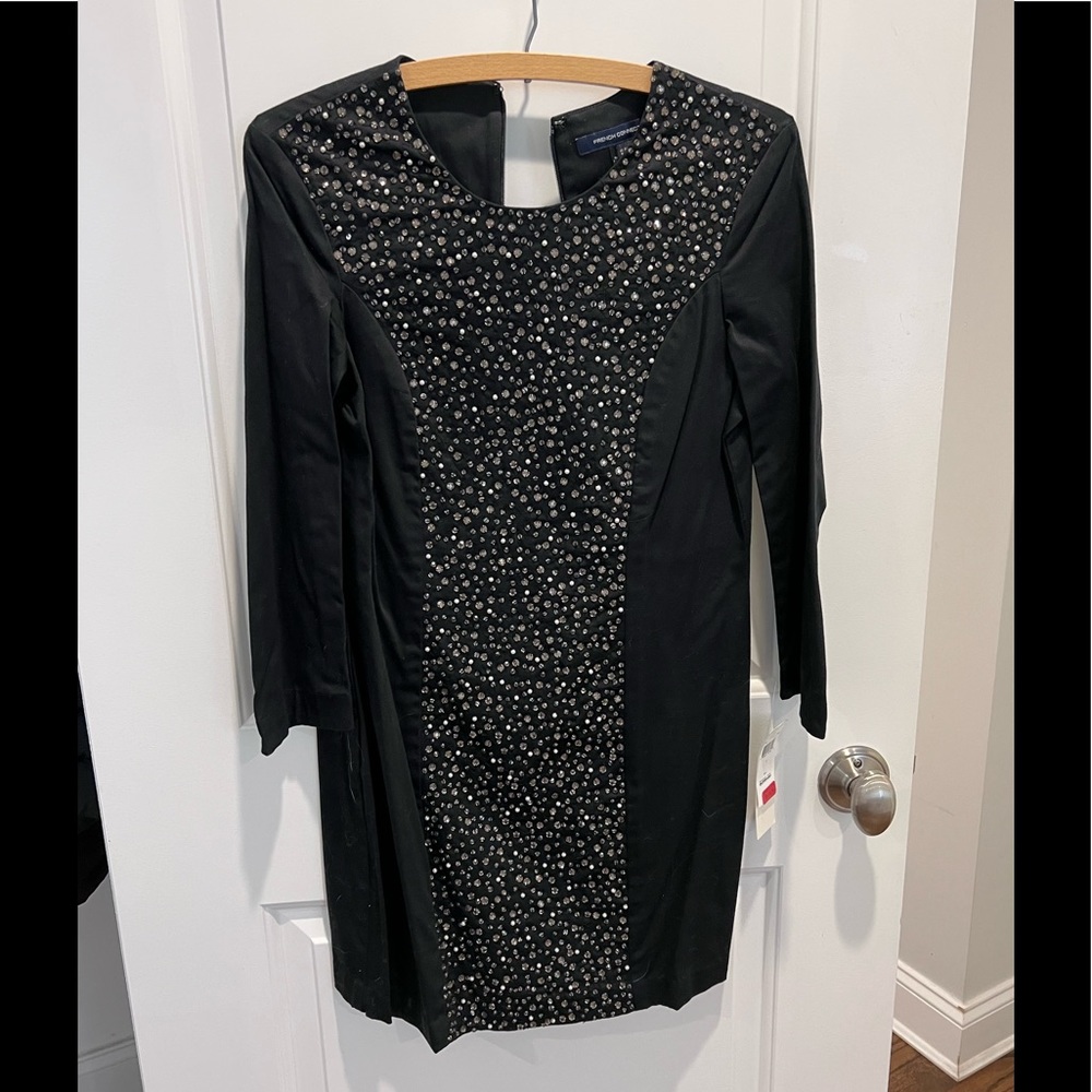Never worn black dress with cream and gold beads down the middle